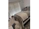 Cozy bedroom with a comfortable bed, plush throw pillows, and bright natural lighting at 328 Glenridge Ct, Indian Trail, NC 28079