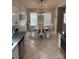Eat-in kitchen featuring dining area with a round table and bright windows at 328 Glenridge Ct, Indian Trail, NC 28079