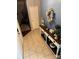 Inviting foyer with tile flooring and stylish console table at 328 Glenridge Ct, Indian Trail, NC 28079
