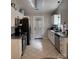 Modern kitchen with stainless steel appliances, granite counters and tile flooring at 328 Glenridge Ct, Indian Trail, NC 28079