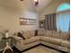 Comfortable living room features large sectional sofa, soft rug, and vaulted ceiling at 328 Glenridge Ct, Indian Trail, NC 28079