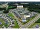 Aerial view of a residential community, highlighting the community pool and overall neighborhood layout at 3313 Plum Dr, Monroe, NC 28110