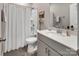 Modern bathroom featuring a shower-tub combo, quartz countertop vanity, and neutral color palette at 3313 Plum Dr, Monroe, NC 28110