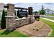 Stone community sign for Simpson Farms with well-manicured landscaping around the entrance at 3313 Plum Dr, Monroe, NC 28110