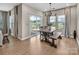 Bright dining area featuring sliding doors and a wooden table with bench seating at 3313 Plum Dr, Monroe, NC 28110