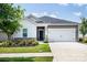 Charming home with a manicured lawn, two-car garage and stylish exterior elements at 3313 Plum Dr, Monroe, NC 28110