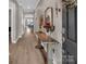 Inviting hallway with decorative mirror and console table, leading to the main living areas at 3313 Plum Dr, Monroe, NC 28110