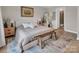 Comfortable main bedroom with neutral decor, natural light, and an en-suite bathroom for added privacy at 3313 Plum Dr, Monroe, NC 28110