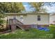 Exterior backyard of home featuring a wooden porch with stairs and green lawn at 333 Friendship Dr, Rock Hill, SC 29730