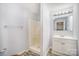 Bathroom features a shower, single vanity with sink, mirror, and modern flooring at 333 Friendship Dr, Rock Hill, SC 29730