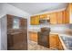 Kitchen featuring wood cabinets, laminate countertops, and updated stainless steel microwave at 333 Friendship Dr, Rock Hill, SC 29730