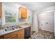 Kitchen featuring light wood cabinets, a double sink, and access to a laundry area at 333 Friendship Dr, Rock Hill, SC 29730