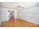 Living room with wood floors, a ceiling fan and a view into other rooms at 333 Friendship Dr, Rock Hill, SC 29730