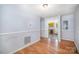 Open living area with wood floors flowing into the kitchen with light wood cabinets at 333 Friendship Dr, Rock Hill, SC 29730