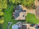 Aerial view showcasing the house with a deck, expansive lawn, pool, and landscaped backyard at 3705 Chesapeake Pl, Waxhaw, NC 28173
