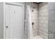 This bathroom features a shower with white subway tile and a glass door at 3705 Chesapeake Pl, Waxhaw, NC 28173