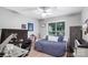 This bedroom features a window, a bed with modern accents and plenty of workspace at 3705 Chesapeake Pl, Waxhaw, NC 28173