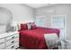 This bedroom features a modern accent color and ample natural light, creating a cozy and inviting atmosphere at 3705 Chesapeake Pl, Waxhaw, NC 28173