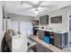 This bonus room features a ceiling fan, a couch and modern finishes at 3705 Chesapeake Pl, Waxhaw, NC 28173