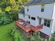 The outdoor deck is an ideal place to unwind or entertain, with an outdoor dining set and comfortable lounge chairs at 3705 Chesapeake Pl, Waxhaw, NC 28173