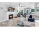Inviting living area with a fireplace, comfortable seating, and seamless access to the outdoor patio at 3705 Chesapeake Pl, Waxhaw, NC 28173