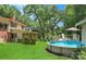 Backyard oasis with an above-ground swimming pool, deck, and lush green grass, perfect for summer relaxation and entertaining at 408 E Blume St, Landis, NC 28088