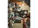 A cluttered basement with wire shelving, storage bins, and miscellaneous items filling the space at 408 E Blume St, Landis, NC 28088