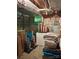 View of a basement with stored items, including suitcases, cleaning supplies, and a freezer at 408 E Blume St, Landis, NC 28088