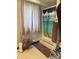 Cozy bathroom featuring mosaic tile floors, striped shower curtain and towel rack with rolled-up towels at 408 E Blume St, Landis, NC 28088