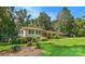 Exterior of home featuring a well maintained lawn, mature trees, and charming curb appeal on a sunny day at 408 E Blume St, Landis, NC 28088