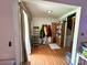 Hallway showcasing hardwood floors and coat rack at 408 E Blume St, Landis, NC 28088