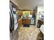 Kitchen featuring granite countertops, tile floors, stainless steel appliances, and natural wood cabinetry at 408 E Blume St, Landis, NC 28088