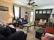 Comfortable living room with ceiling fan, couches, an area rug, and a television at 408 E Blume St, Landis, NC 28088