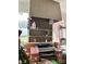 A view of the sunroom featuring a unique fireplace, shelves and a view of the backyard at 408 E Blume St, Landis, NC 28088