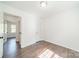 Spare bedroom with hardwood floors, featuring a closet and neutral paint, providing a versatile space at 4230 Chatterleigh Dr, Monroe, NC 28110