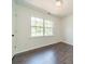 Light bedroom with wood floors, featuring a bright window with natural light and white walls at 4230 Chatterleigh Dr, Monroe, NC 28110