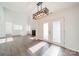 Bright and open living room with a fireplace and modern lighting at 4230 Chatterleigh Dr, Monroe, NC 28110
