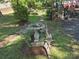 A backyard featuring a bird bath, lush greenery, and decorative elements, creating a serene and inviting outdoor space at 44112 Harper Hearne Rd, New London, NC 28127