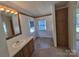 Bathroom featuring tile flooring, double windows, and vanity at 44112 Harper Hearne Rd, New London, NC 28127