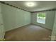 Bedroom with neutral carpet, one window and a door to closet at 44112 Harper Hearne Rd, New London, NC 28127