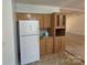 Functional kitchenette area equipped with built-in cabinets and a refrigerator at 44112 Harper Hearne Rd, New London, NC 28127