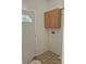 Small laundry room with storage cabinets, washer dryer hookups, and neutral flooring at 44112 Harper Hearne Rd, New London, NC 28127