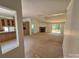 Spacious living room with a fireplace, ceiling fan, and sliding glass doors at 44112 Harper Hearne Rd, New London, NC 28127