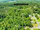 Aerial view of property showing acreage with property lines outlined; wooded lot in a serene setting at 485 Johnson St, China Grove, NC 28023