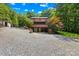Exterior view of home and partially gravel yard with an attached screened porch at 485 Johnson St, China Grove, NC 28023