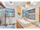 Well-lit bathroom featuring a unique vessel sink, tiled shower, and decorative mirror for a spa-like experience at 485 Johnson St, China Grove, NC 28023