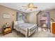 Bright bedroom with a ceiling fan, patterned bedding, and ample natural light for a restful retreat at 485 Johnson St, China Grove, NC 28023