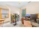 Bright bedroom with an exercise bike, shelving, and desk, creating a versatile space for work and fitness at 485 Johnson St, China Grove, NC 28023