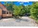 Exterior of house with partially gravel yard and a detached carport or garage at 485 Johnson St, China Grove, NC 28023