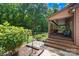 Exterior of home featuring a covered porch with wooden steps, stone pathway, and lush landscaping at 485 Johnson St, China Grove, NC 28023